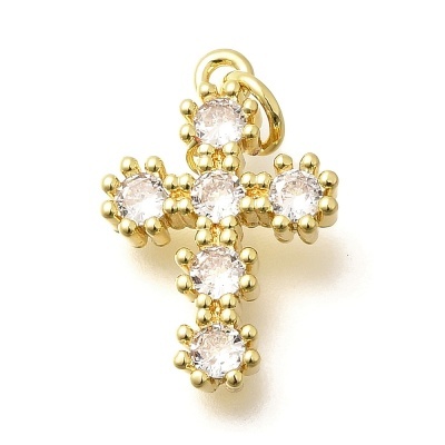 Pendente dourado em forma de cruz com pedras transparentes