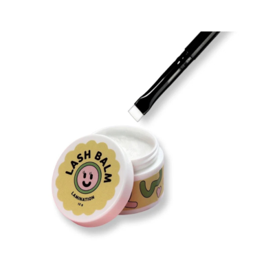 Bálsamo para pestanas em embalagem branca com tampa amarela e escova preta