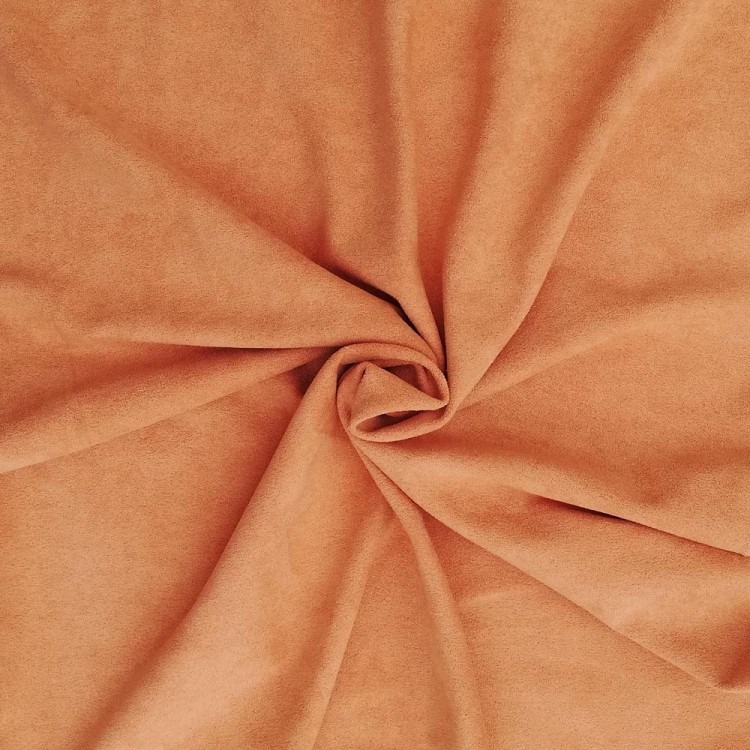 Tecido ou manta cor laranja claro com textura aveludada em espiral