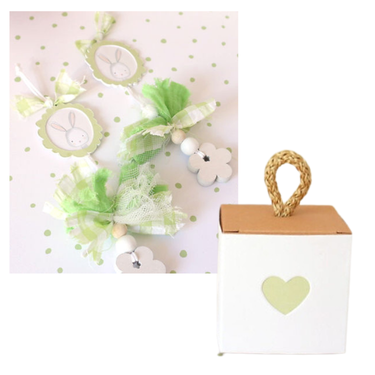 Fitas decorativas verdes e brancas com contas e figura de coelho, ao lado de uma caixa branca com coração verde e alça de corda