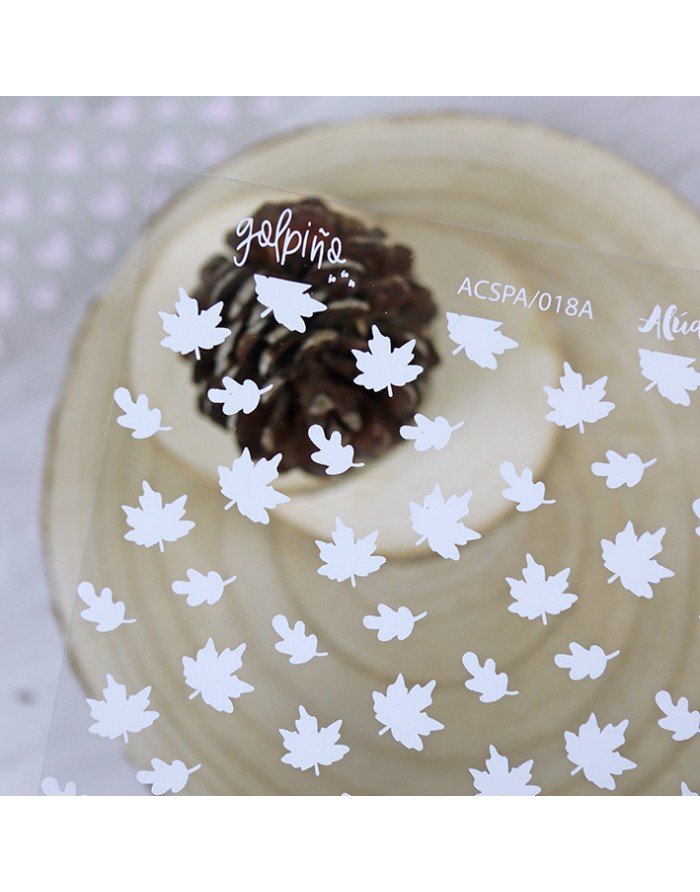 Autocolantes decorativos brancos com padrão de folhas em superfície transparente