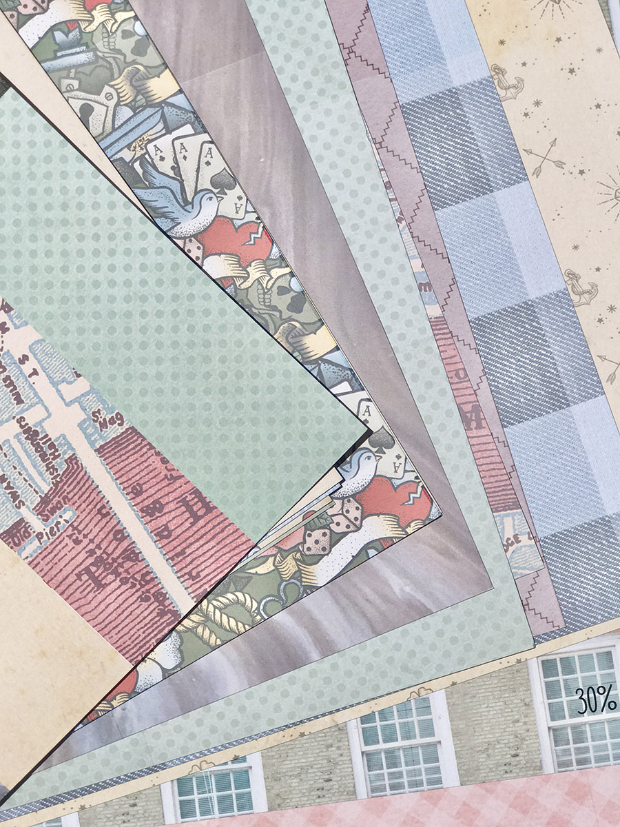 Papel decorativo colorido com vários padrões dispostos em leque