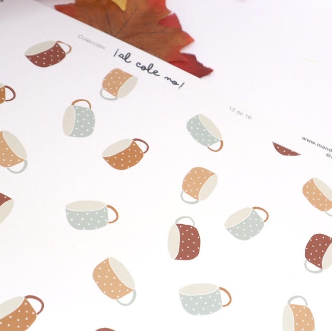 Papel com padrão de chávenas coloridas e uma folha seca castanha em cima