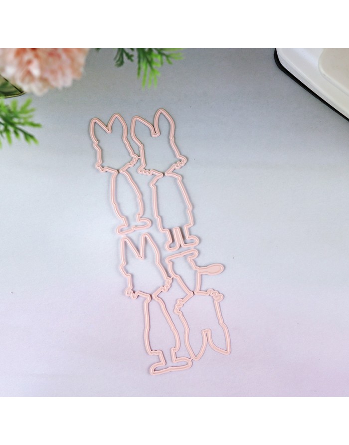 Clips de papel rosa em forma de coelhos sobre mesa branca