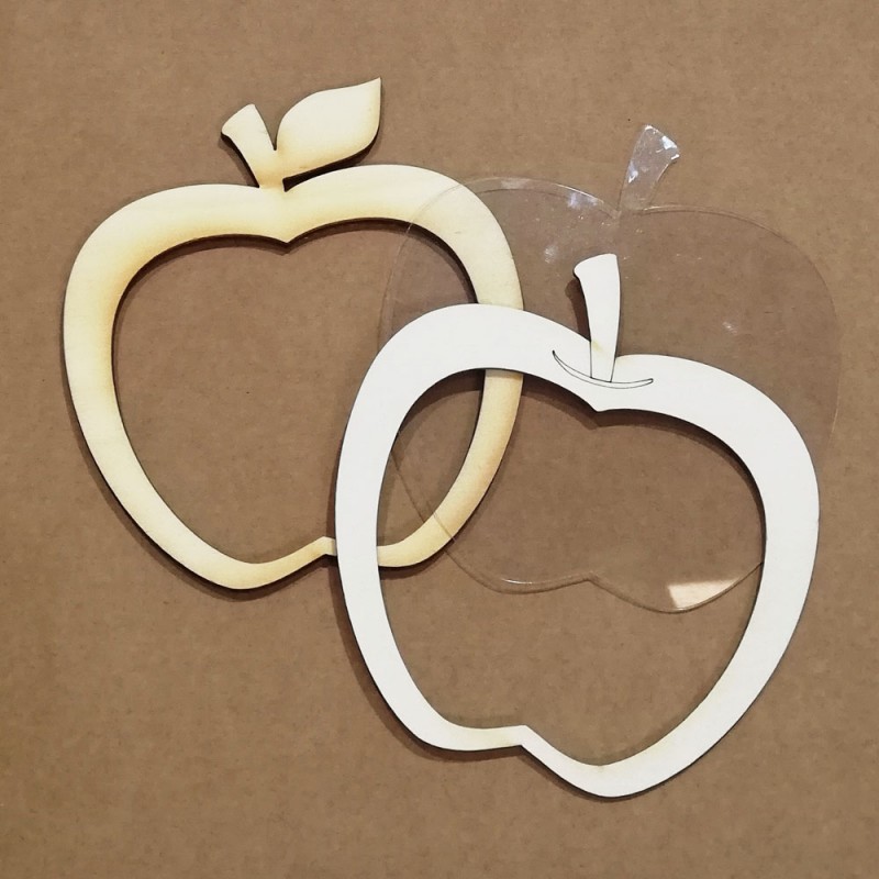 Duas molduras em forma de maçã, uma de madeira clara e outra branca com parte transparente.