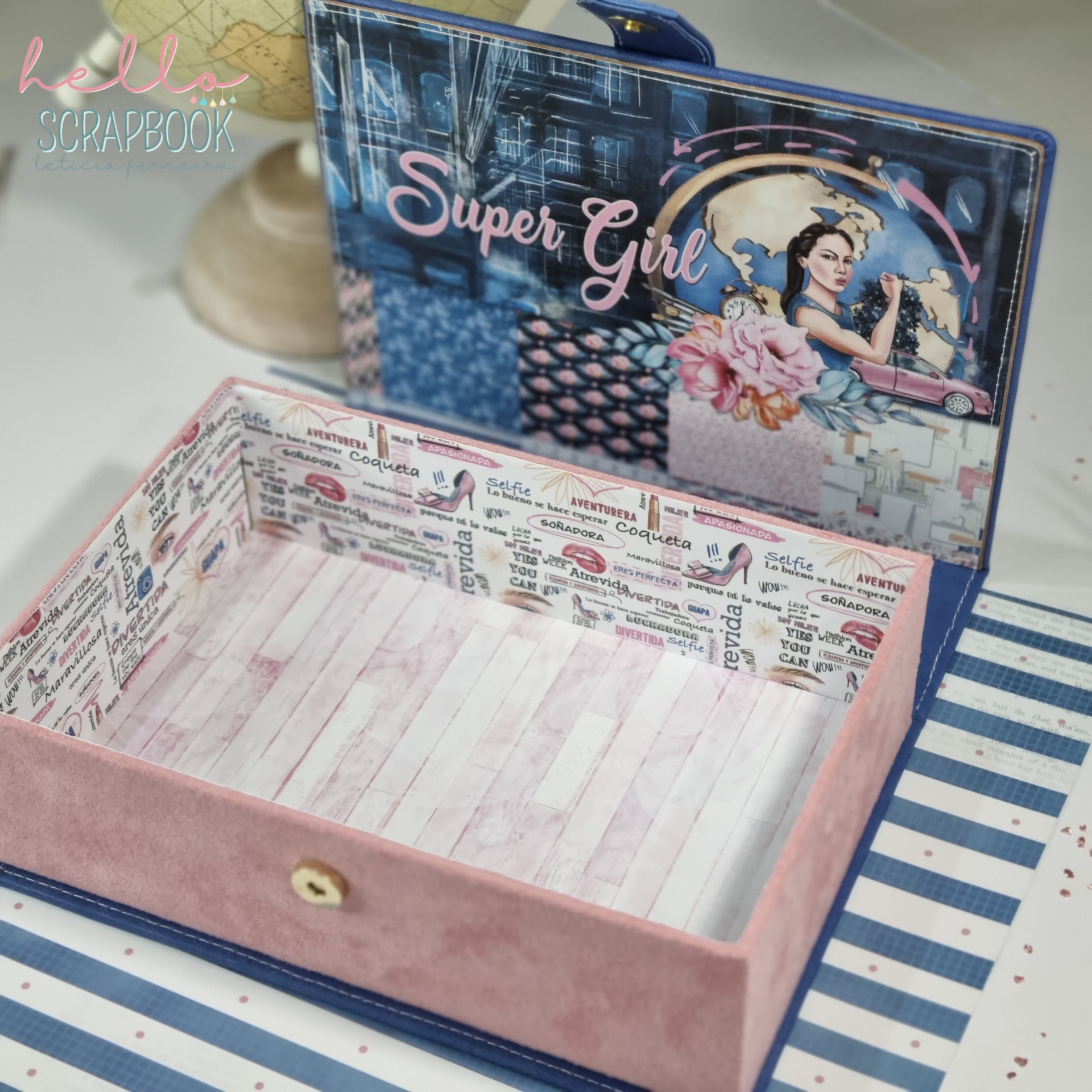 Caixa decorativa aberta com imagem 'Super Girl' e padrões coloridos.