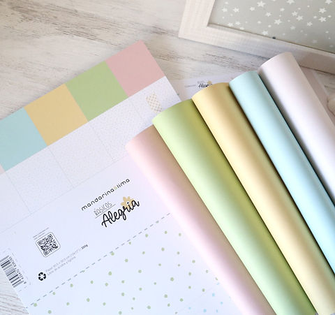 Papéis de embrulho coloridos em tons pastel com padrões e texto manzanita lindo Alegria