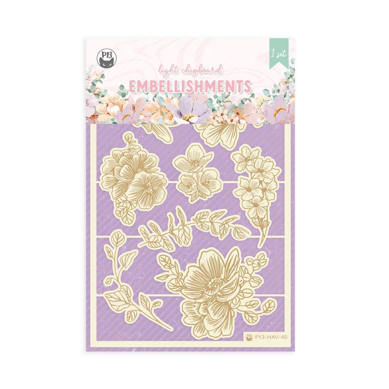 Embalagem de embelezamentos com flores douradas em fundo lilás para scrapbooking