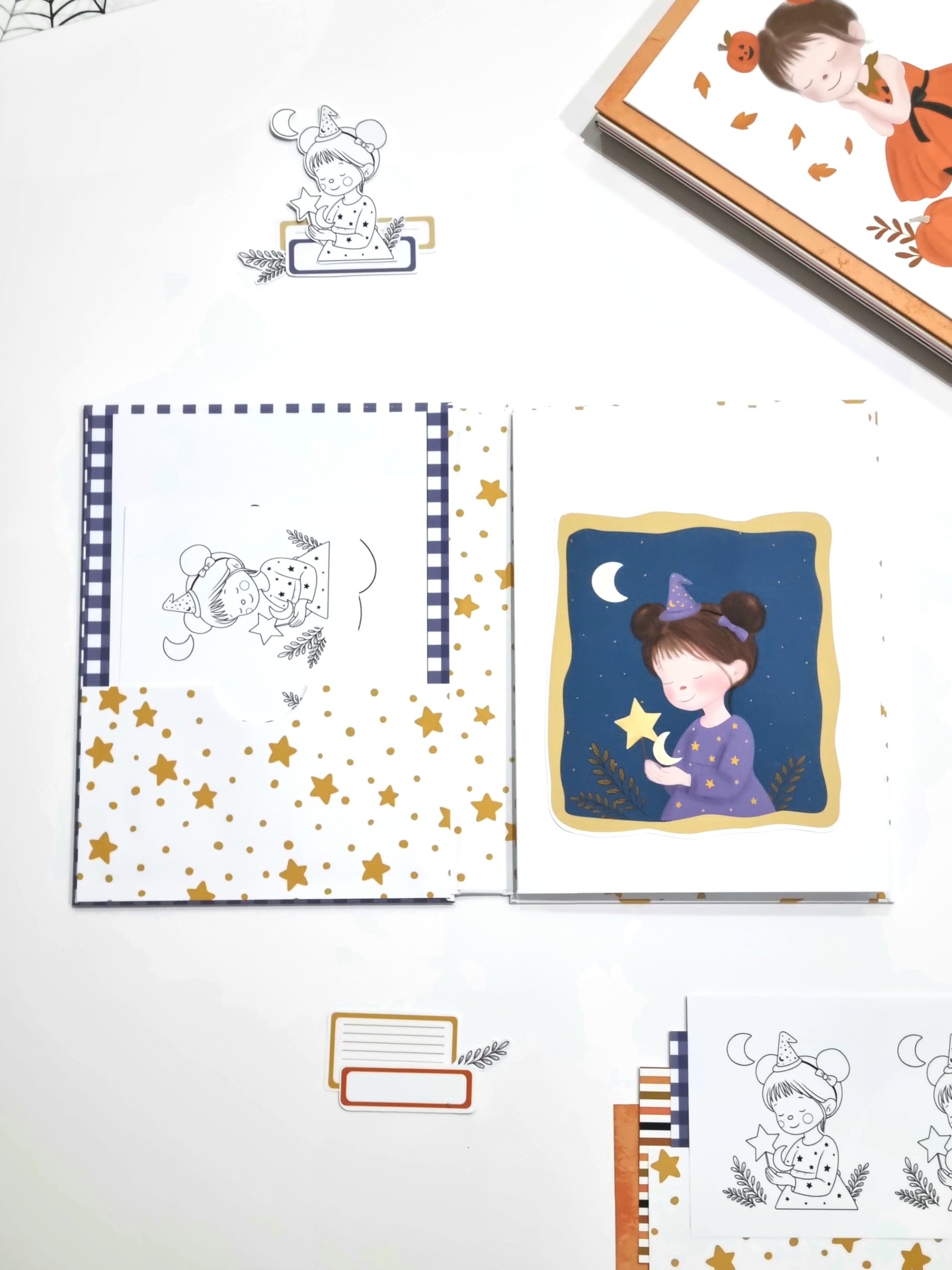 Conjunto de papelaria infantil com ilustrações de menina e estrelas em várias cores.