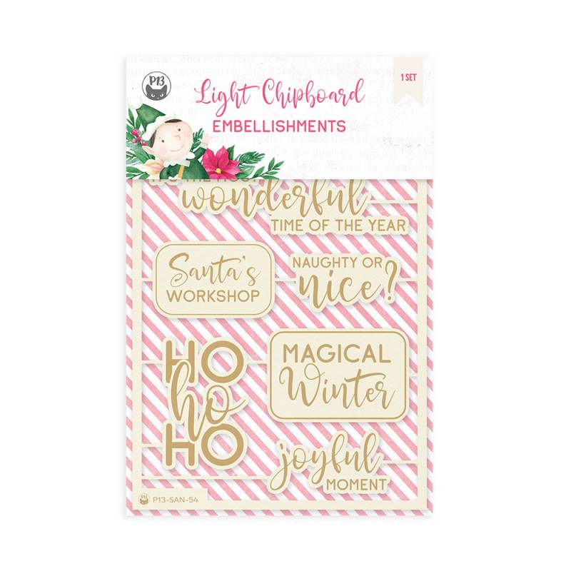 Embellishments de chipboard com frases temáticas de Natal em dourado sobre fundo rosa com riscas brancas