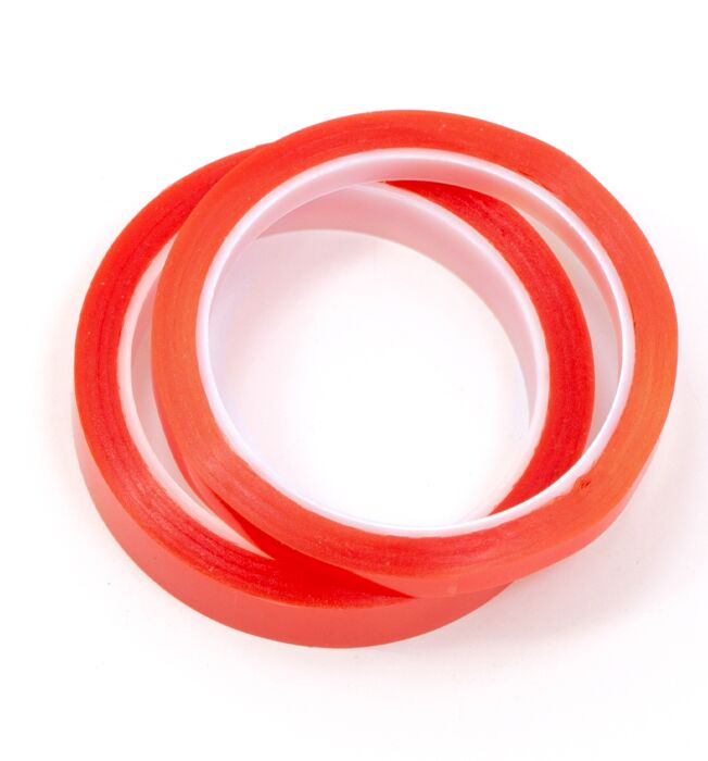 Duas fitas adesivas vermelhas finas com interior branco