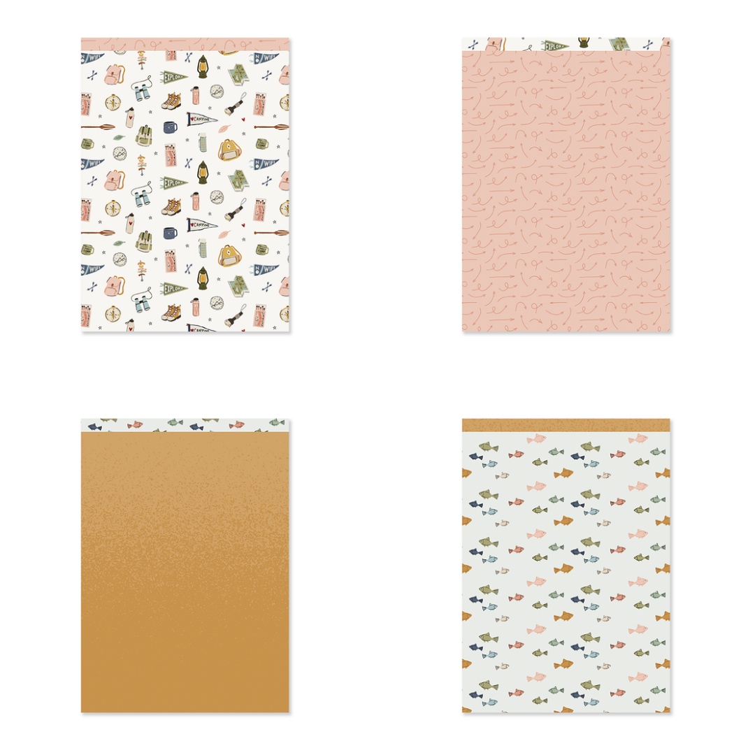 Quatro cadernos com diferentes padrões e cores nas capas.