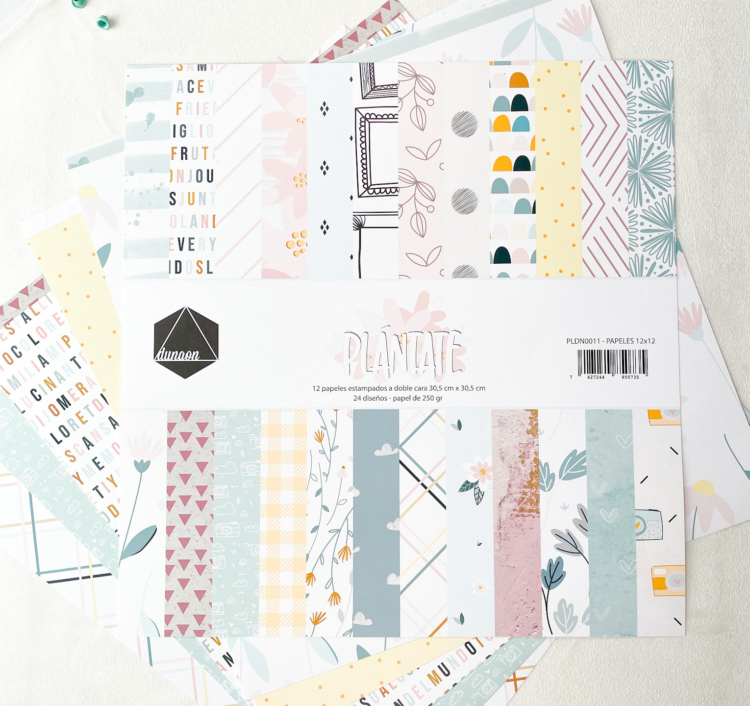 Folhas de papel estampado para artesanato com diversos padrões e cores suaves