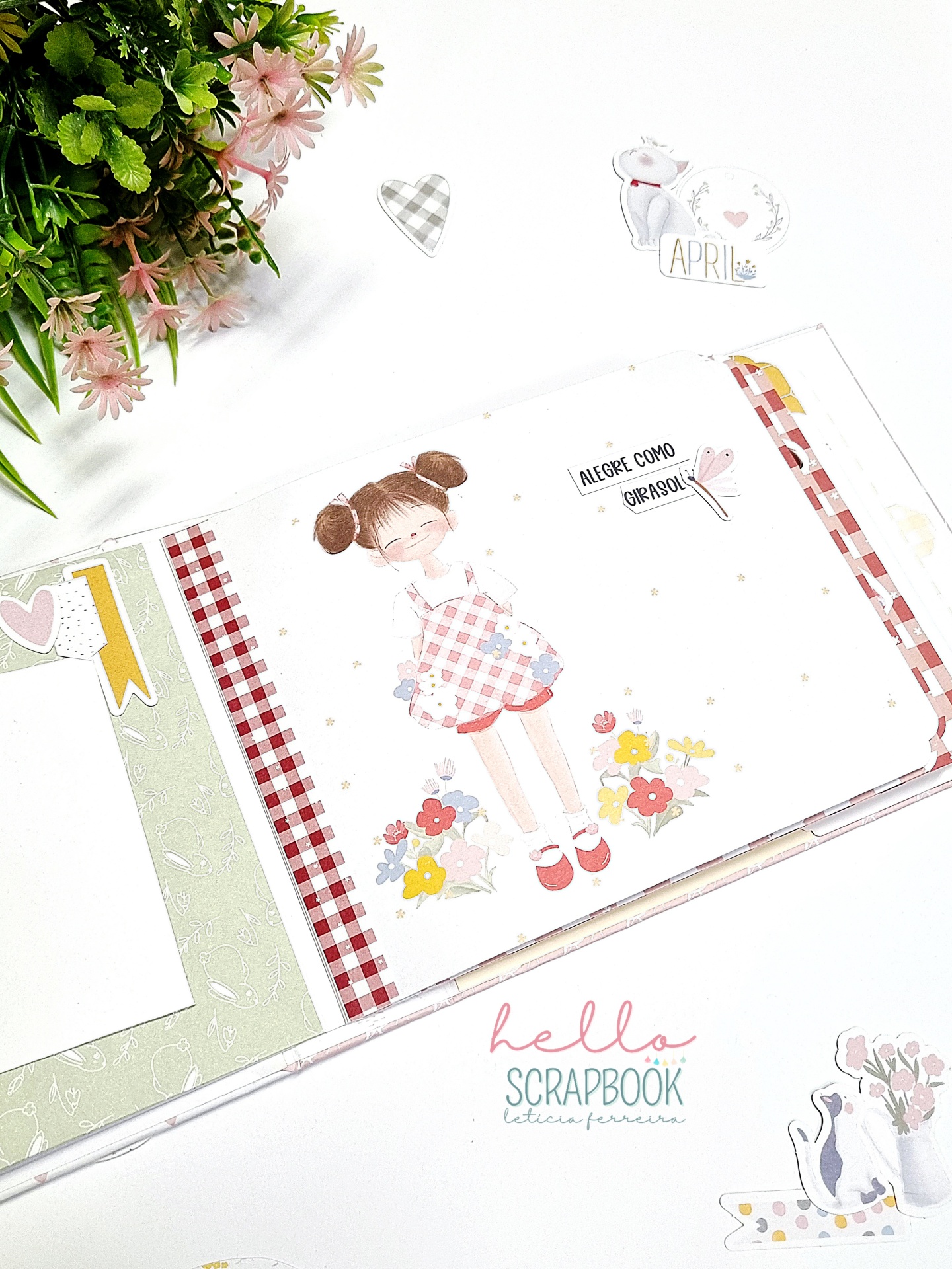 Página branca de scrapbook com ilustração de menina, flores, padrões xadrez e etiquetas decorativas