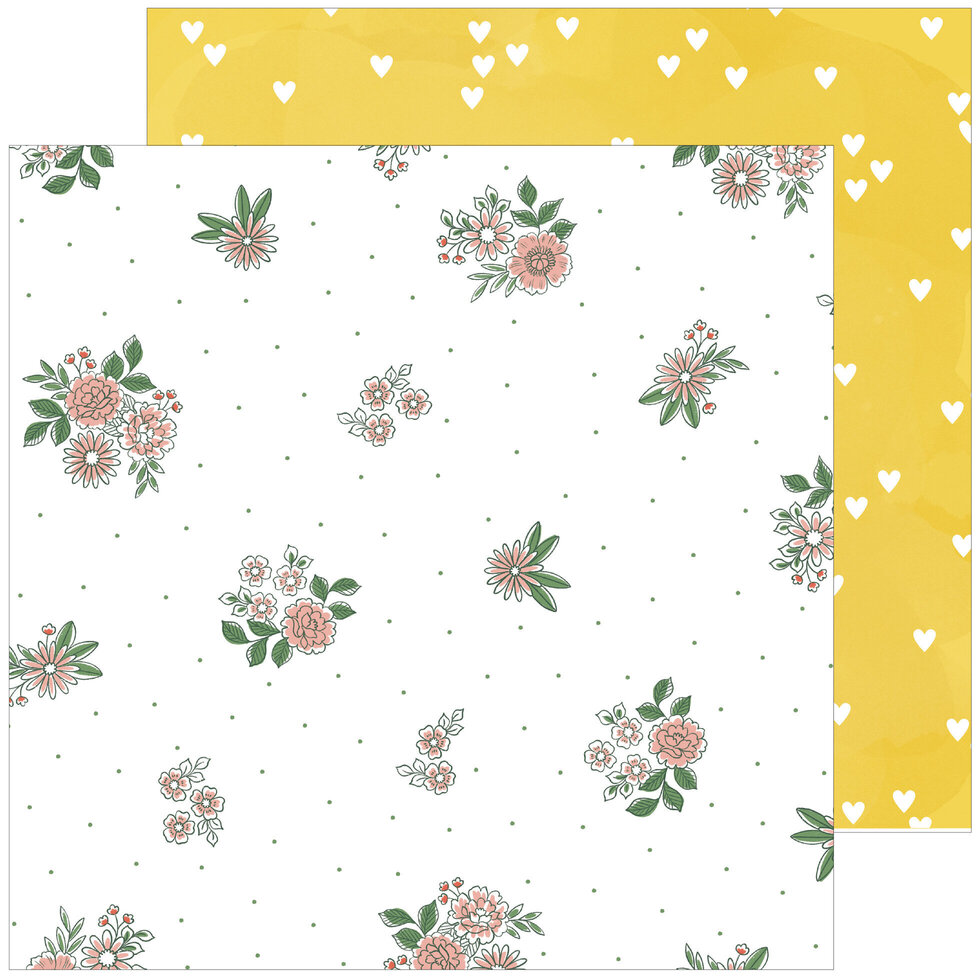 Papel decorativo com padrão floral e verso amarelo com corações brancos