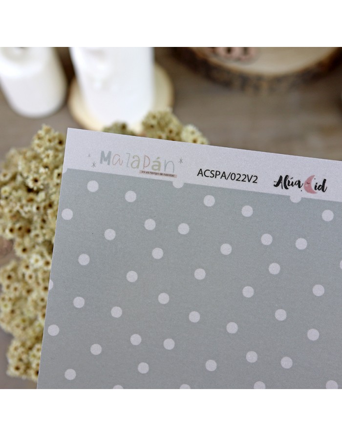 Folha de papel decorativo com padrão de bolinhas brancas sobre fundo cinza