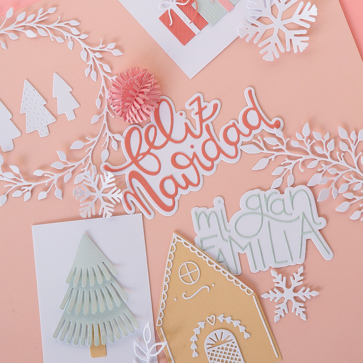 Decoração natalícia em papel com árvores, flocos de neve, casa e inscrições festivas