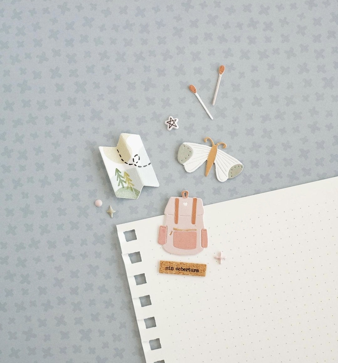 Folha com autocolantes decorativos variados em fundo cinza