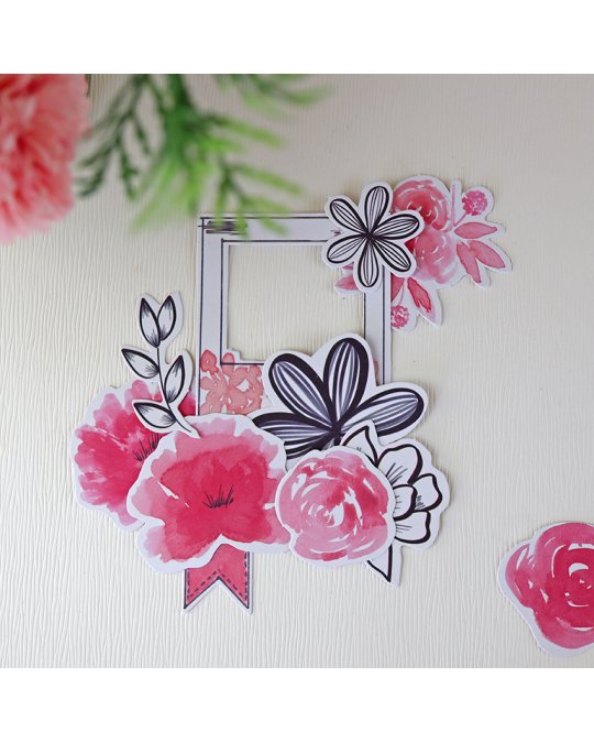 Adesivos de flores rosa, vermelho e preto em fundo branco texturizado