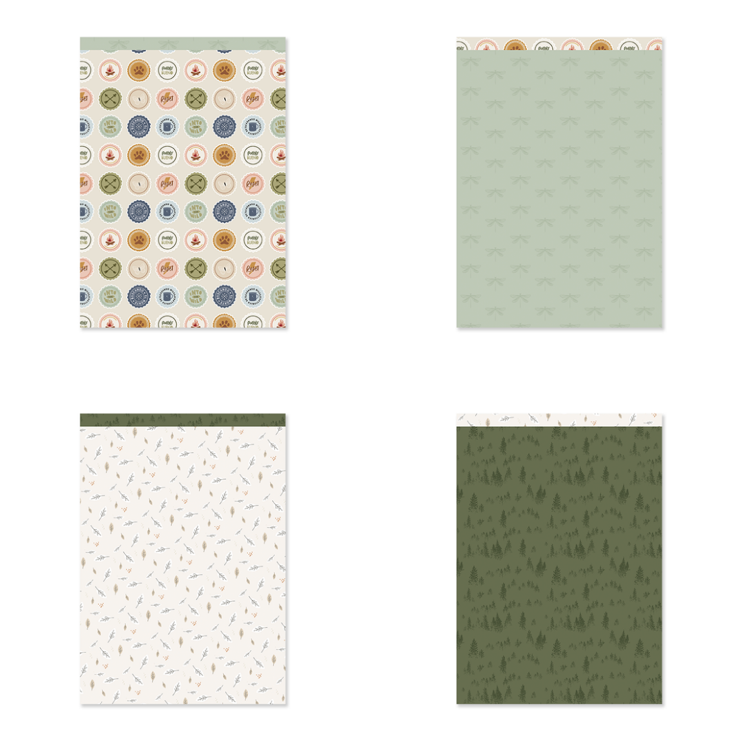 Quatro blocos de papel decorativo com padrões variados, incluindo círculos coloridos, cinza com pequenos elementos, branco com ramos e verde com árvores.