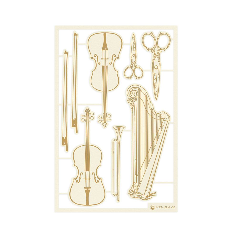 Recortes dourados com desenhos de instrumentos musicais e tesouras em fundo branco