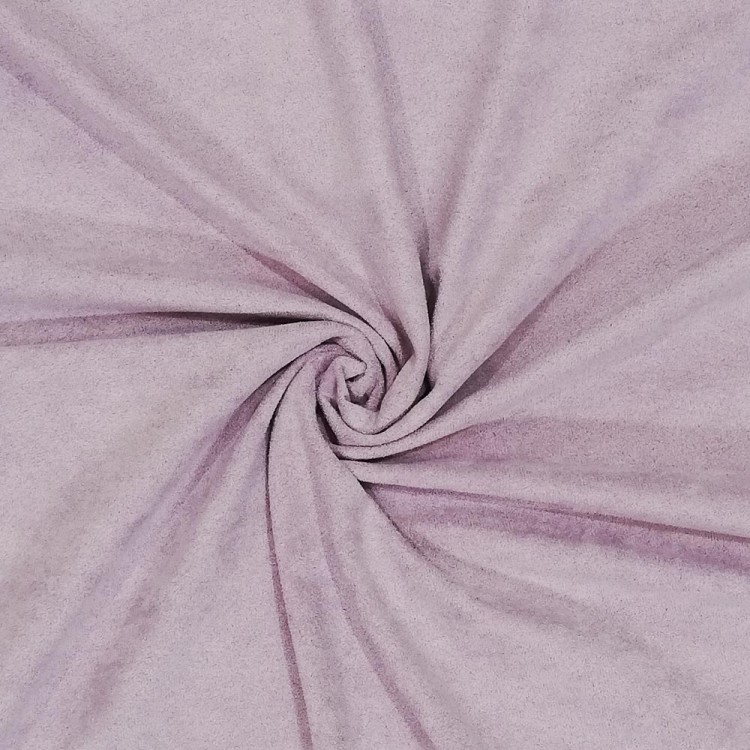 Tecido rosa claro com textura suave enrolado em padrão espiral