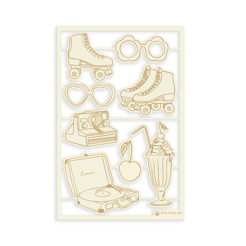 Recortes dourados de objetos retro em folha branca