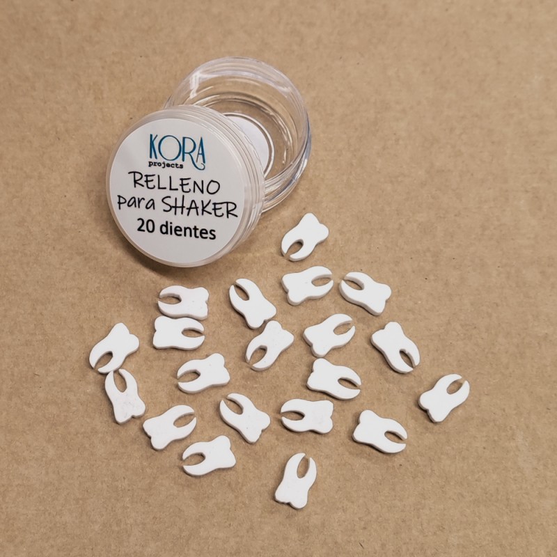 Frasco transparente com tampo e pequenos itens brancos em forma de dentes sobre superfície castanha