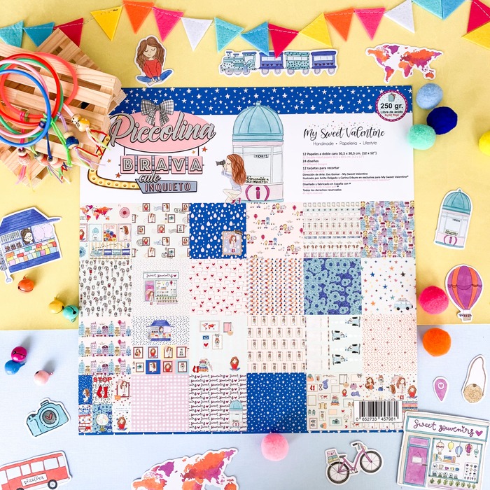 Folhas de papel estampado infantil com temas lúdicos coloridos e padrões variados sobre fundo amarelo e azul decorado.