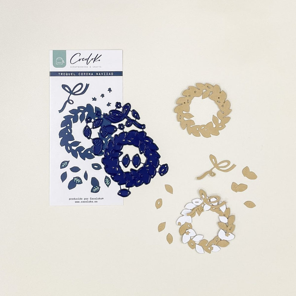 Recortes decorativos em papel com padrões de folhas e coroas em azul, branco e castanho claro