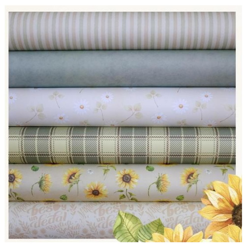 Rolos de tecido com vários padrões, incluindo riscas, liso, flores, xadrez e girassóis.