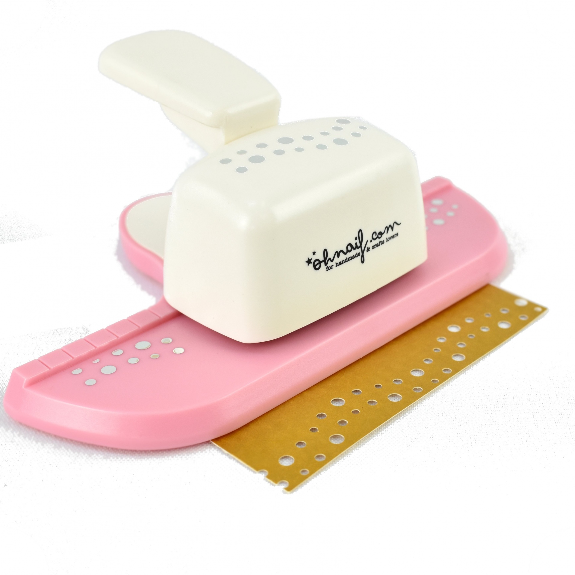 Furador de papel branco e rosa com papel perfurado dourado