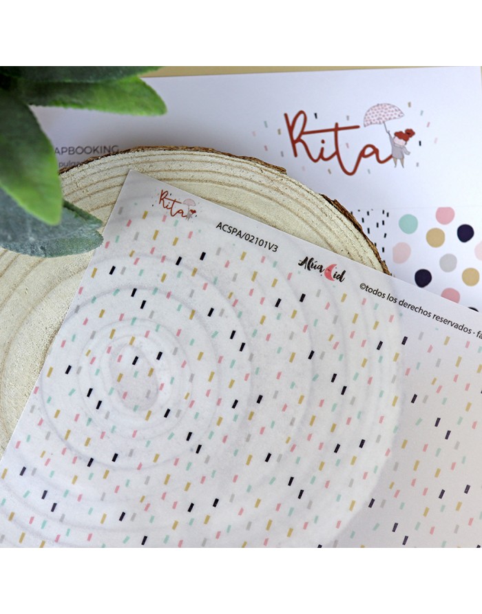 Folhas de papel decorativo com padrões coloridos e marca Kita para scrapbooking