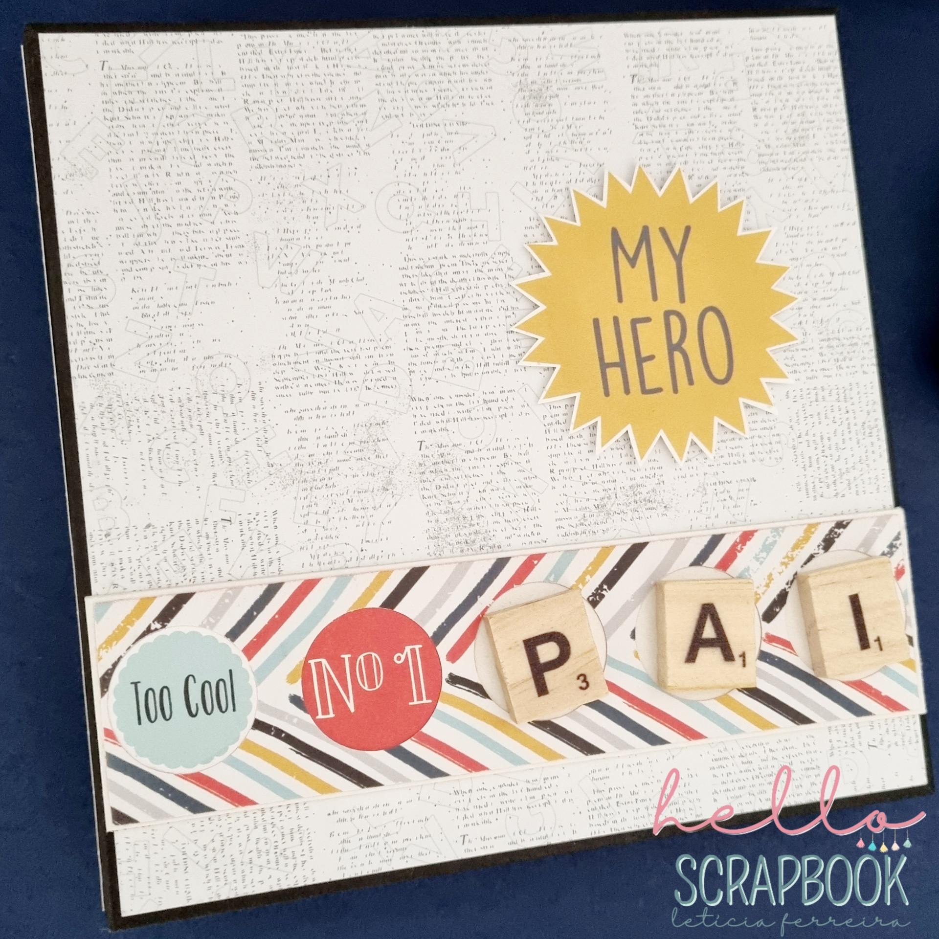Cartão decorativo com texto 'MY HERO', 'Too Cool', 'NO 1' e letras em blocos de madeira 'P A I' sobre fundo riscado colorido