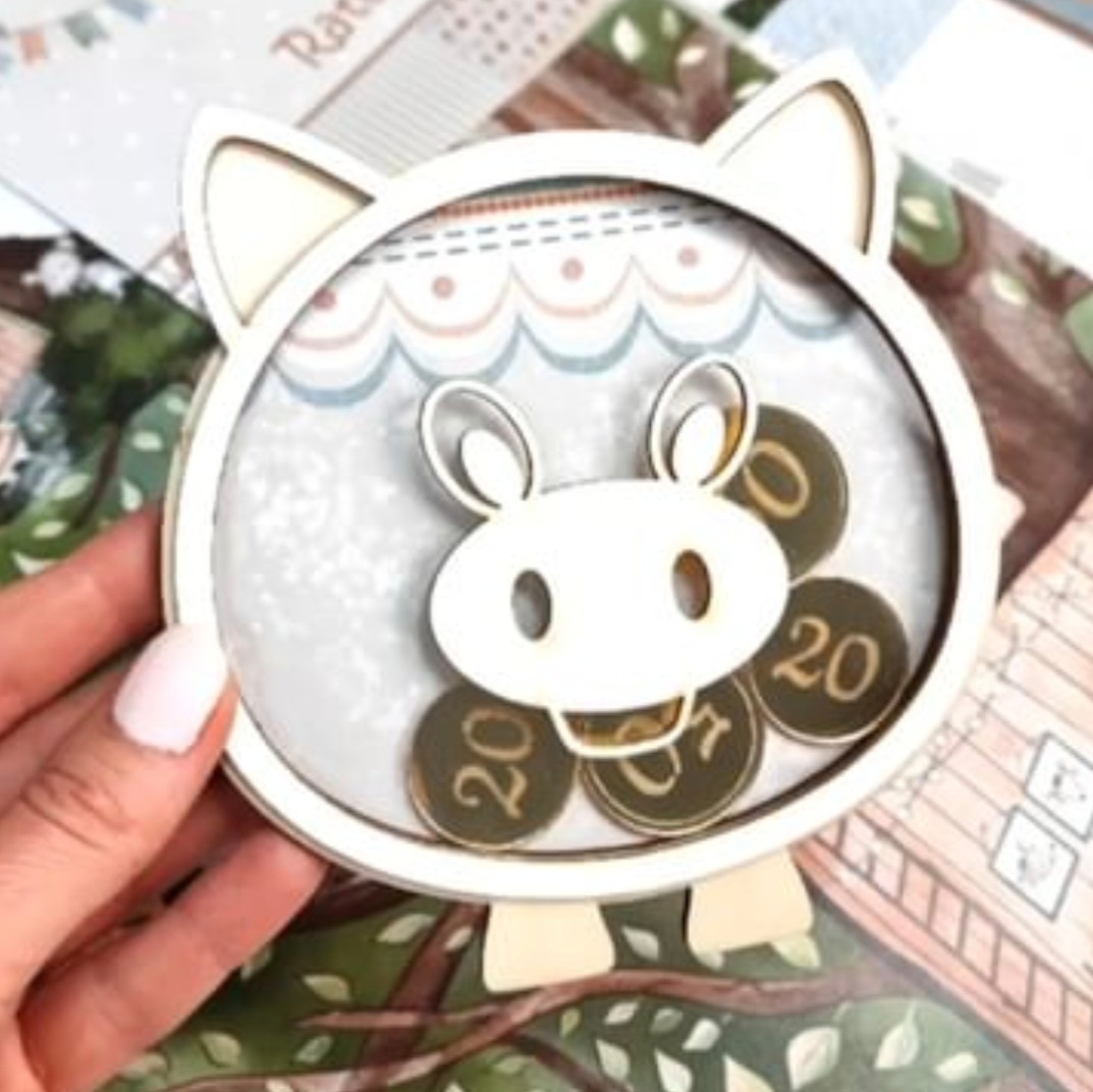 Suporte em forma de vaca com moedas numeradas 20 e 27