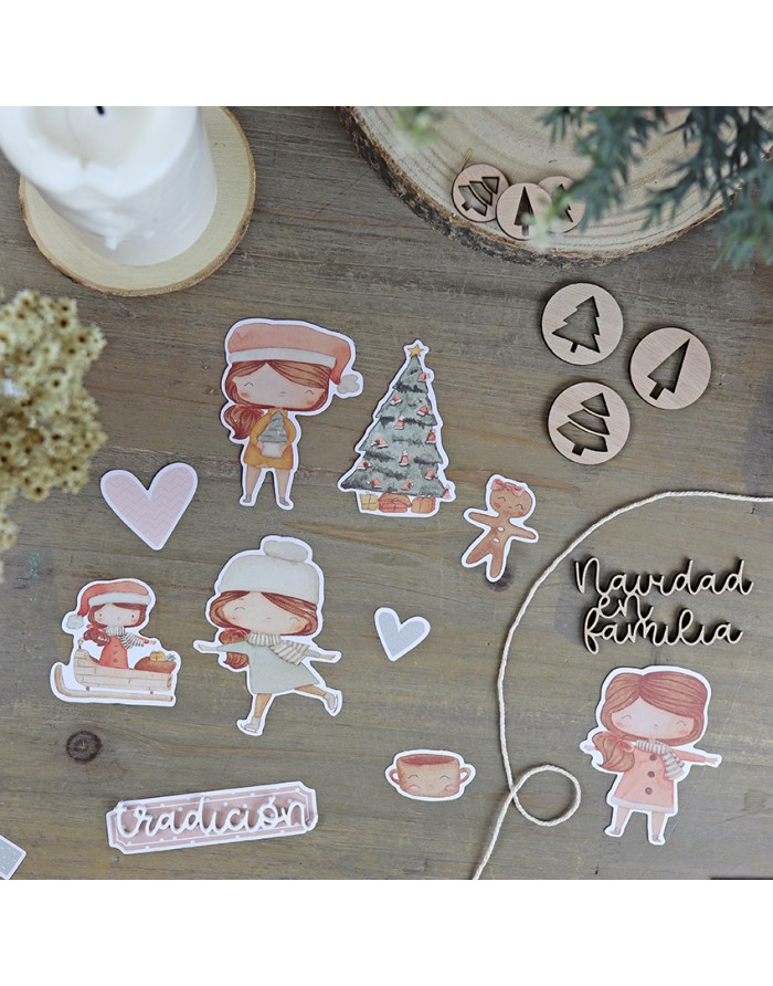 Recortes de papel de personagens infantis e decoração natalina sobre mesa de madeira