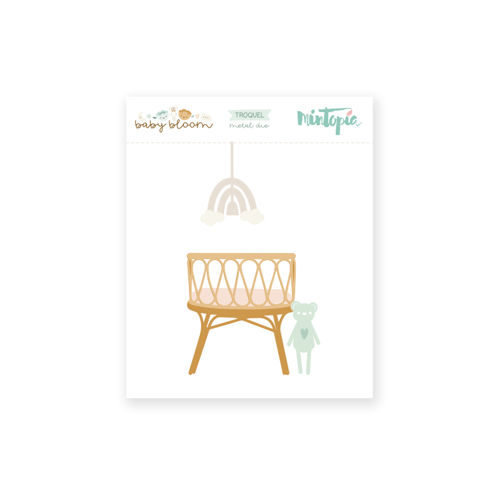 Conjunto de recortes de papel com berço, móbile de arco-íris e ursinho em tons neutros e verde claro.
