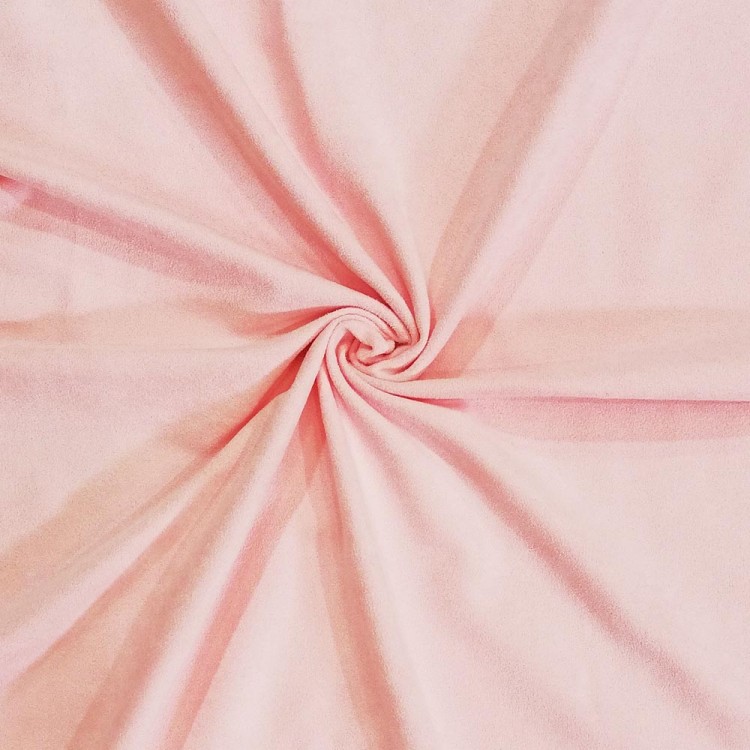 Tecido rosa claro dobrado em espiral