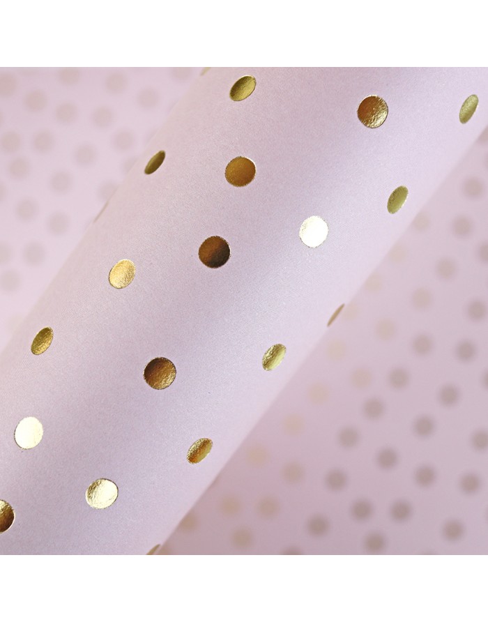Papel de embrulho rosa com pontos dourados brilhantes