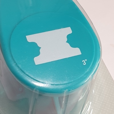 Perfurador de papel azul claro com símbolo branco e texto 3''