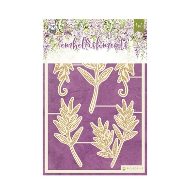 Conjunto de embellishments em chipboard com formas de folhas bege sobre fundo roxo em embalagem decorada