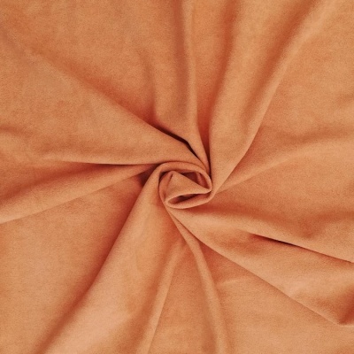 Tecido ou manta cor laranja claro com textura aveludada em espiral