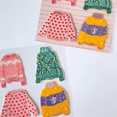 Autocolantes de camisolas de malha coloridas com padrões de Natal embalados