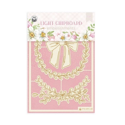 Embellishment em chipboard leve creme com dourado, padrão guirlanda com laço, fundo rosa