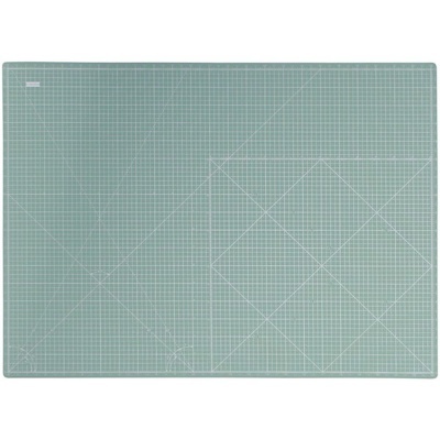 manta de corte verde com grelha branca e linhas de medição