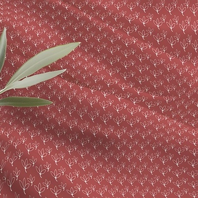 Tecido vermelho com padrão de corações brancos e ramo verde