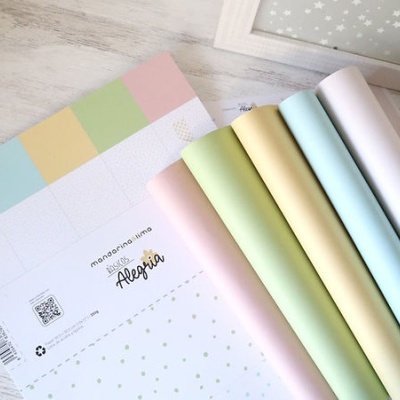 Papéis de embrulho coloridos em tons pastel com padrões e texto manzanita lindo Alegria