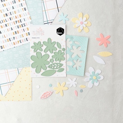 Recortes de papel em forma de flores e folhas com molde metálico em tons pastel