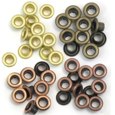 Ilhós metálicos circulares em dourado, bronze e preto sobre fundo branco