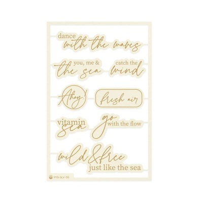 Autocolantes com frases inspiradoras em dourado sobre fundo branco